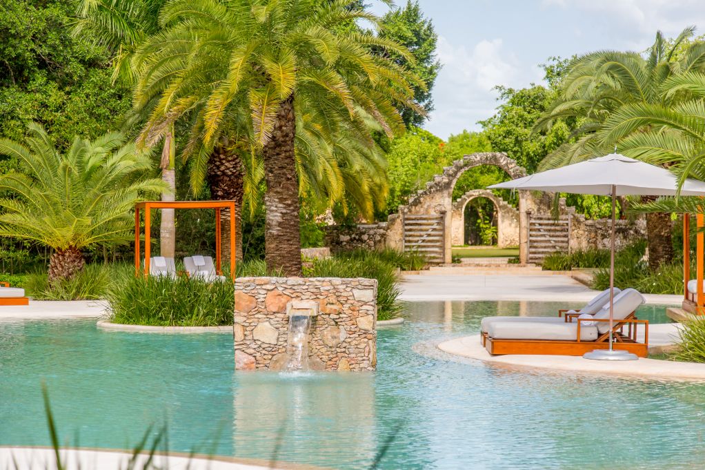 Swimming pool with stone fountain