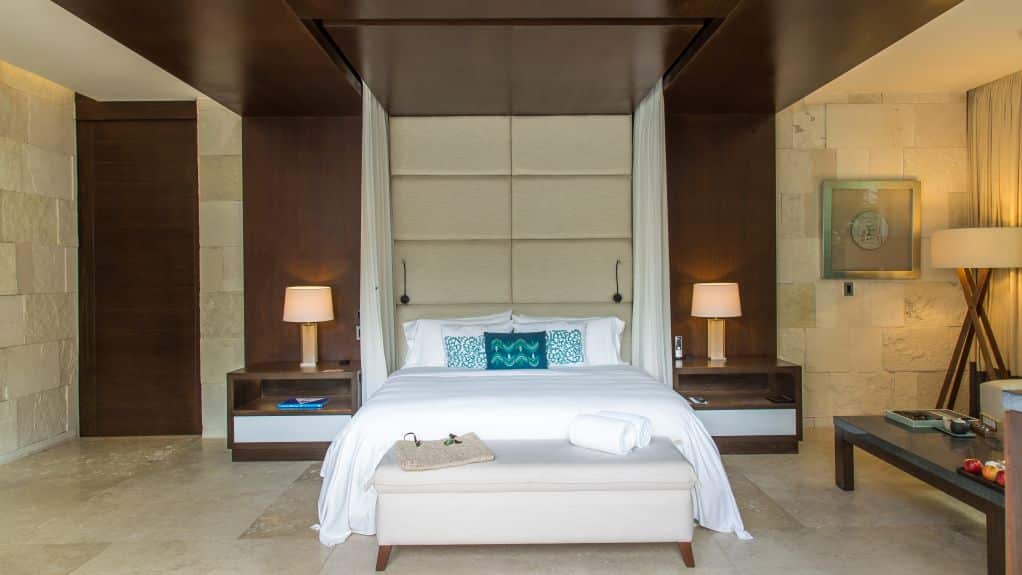 King bed in large, luxury bedroom